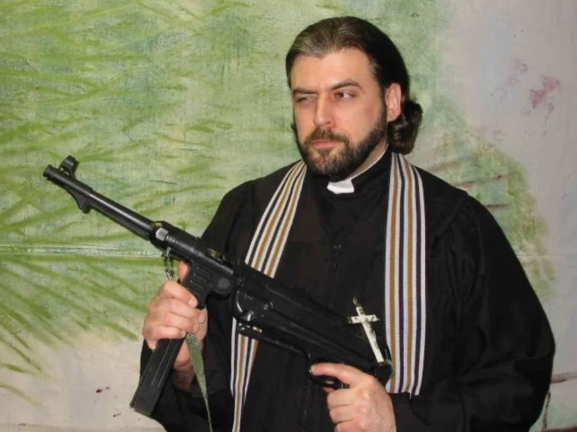 priest with gun